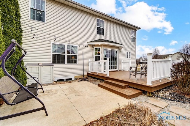 back of property with a patio area and a wooden deck