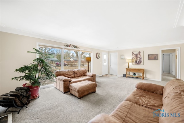 carpeted living room with baseboards and ornamental molding