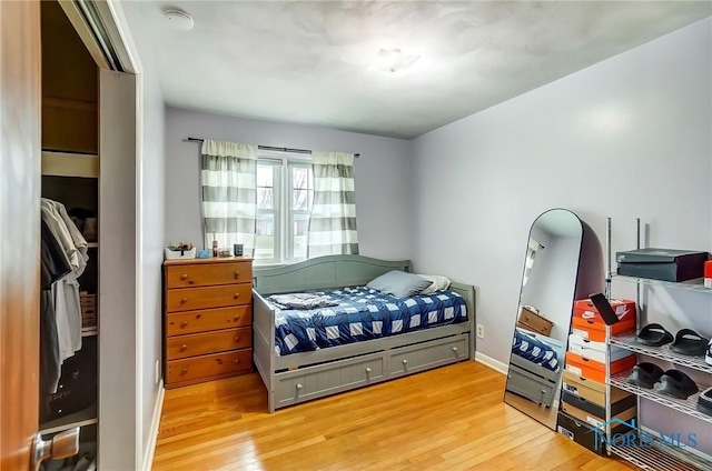 bedroom featuring light wood-type flooring