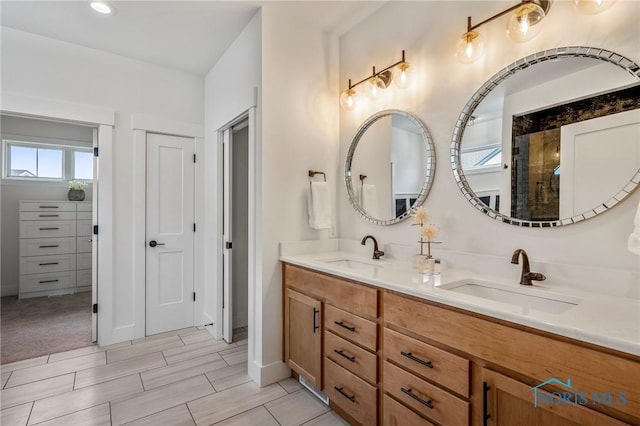 bathroom featuring double vanity and a sink