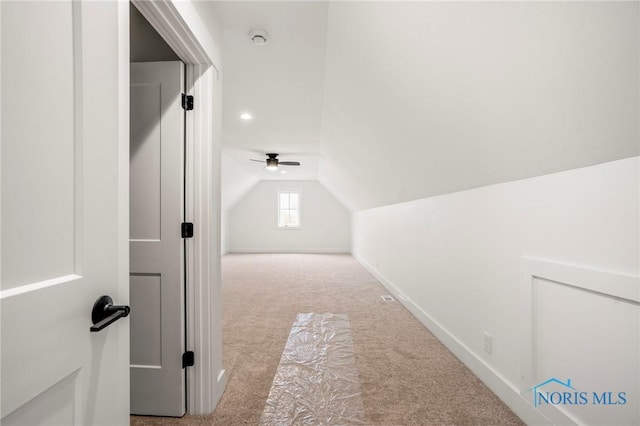 bonus room with carpet floors, lofted ceiling, and baseboards