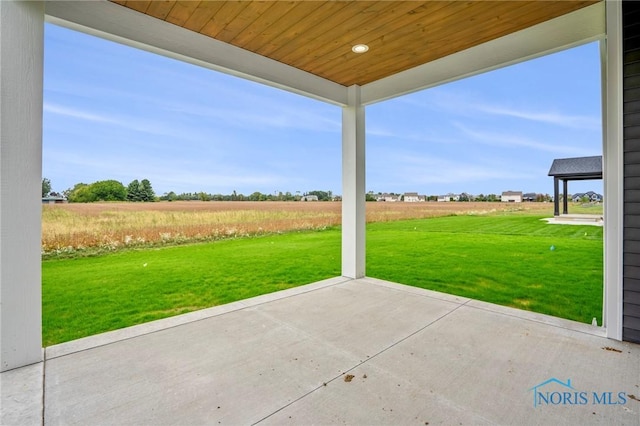 view of patio / terrace with a rural view