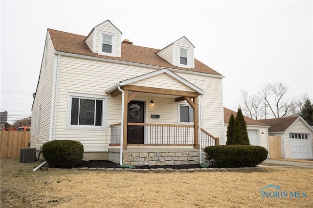 new england style home featuring a porch, central air condition unit, fence, and a shingled roof