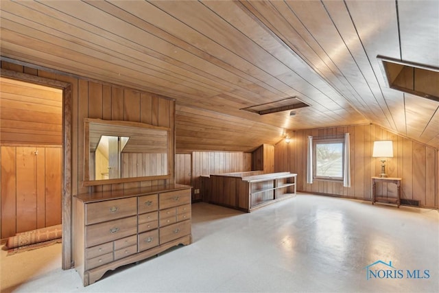 bonus room with lofted ceiling, wood ceiling, and wooden walls