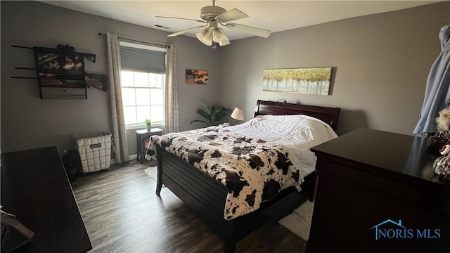 bedroom featuring wood finished floors and a ceiling fan