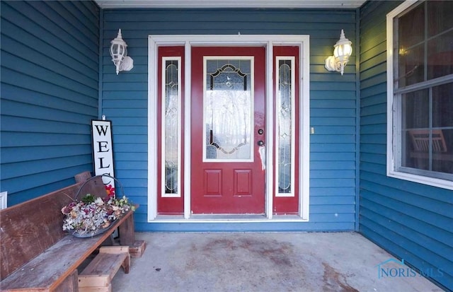 view of exterior entry featuring a porch