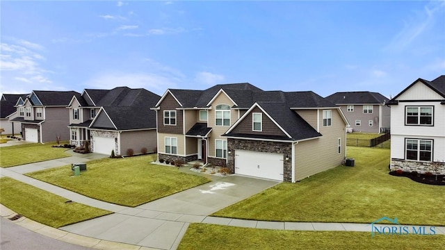 view of front of home featuring driveway, central air condition unit, a residential view, and a front yard