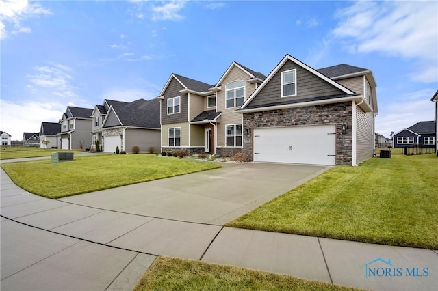 craftsman-style house with a garage, a residential view, concrete driveway, and a front yard