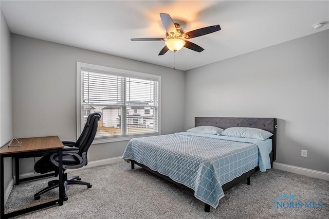 bedroom featuring ceiling fan, carpet flooring, and baseboards