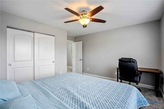 carpeted bedroom featuring a closet, a ceiling fan, and baseboards