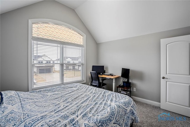 bedroom with carpet floors, baseboards, and vaulted ceiling