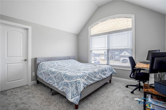 bedroom with lofted ceiling, baseboards, and carpet flooring