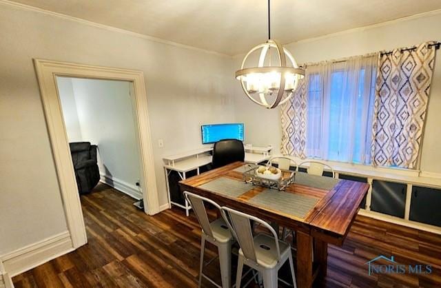 dining room featuring baseboards, crown molding, a chandelier, and dark wood-type flooring