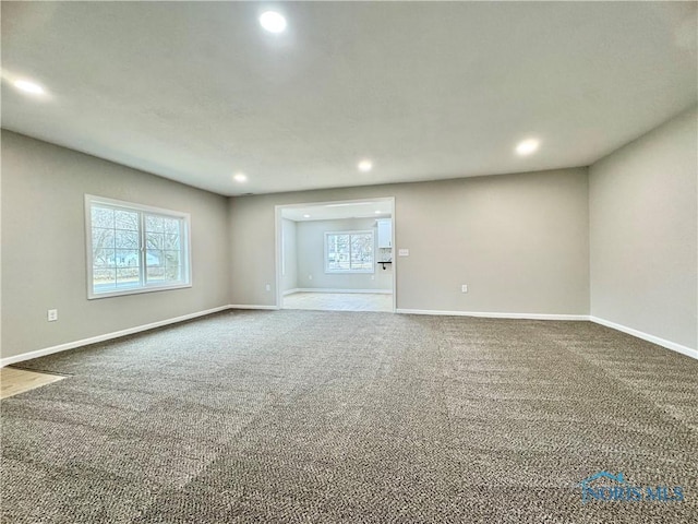 unfurnished room featuring carpet floors, recessed lighting, and baseboards