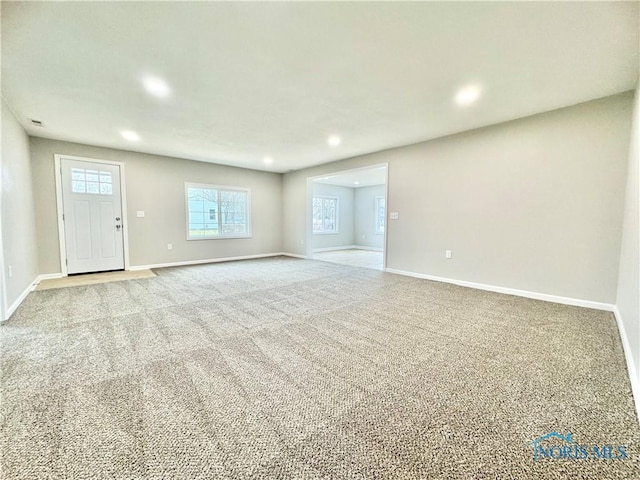 interior space featuring recessed lighting, carpet flooring, and baseboards