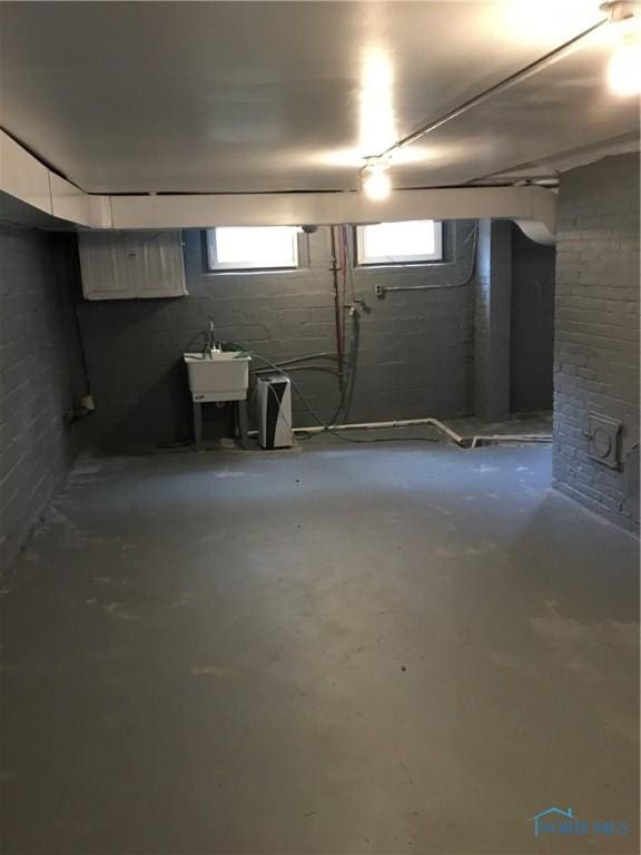 below grade area with a sink