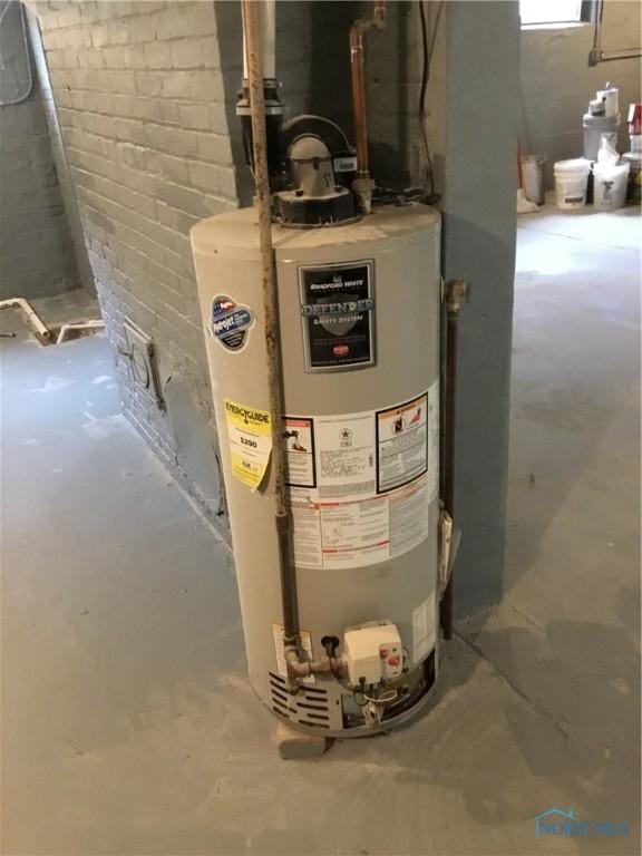 utility room with gas water heater