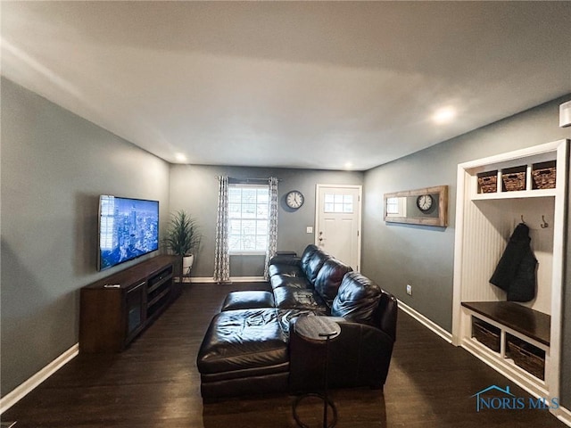 living room with dark wood finished floors and baseboards