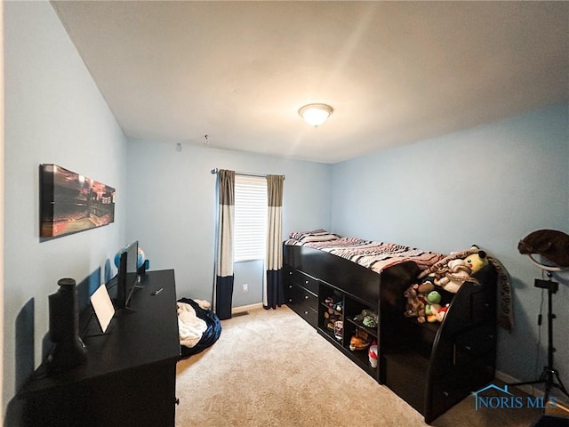 carpeted bedroom with baseboards