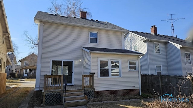 back of house featuring fence