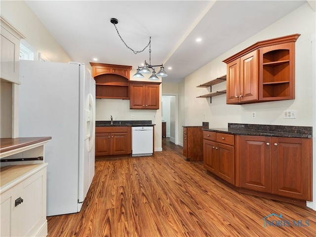 kitchen featuring dark wood-style floors, open shelves, recessed lighting, a sink, and white appliances