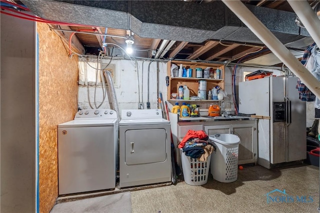 laundry area featuring laundry area and washer and clothes dryer