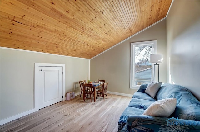 interior space featuring lofted ceiling, ornamental molding, light wood-style floors, baseboards, and wood ceiling