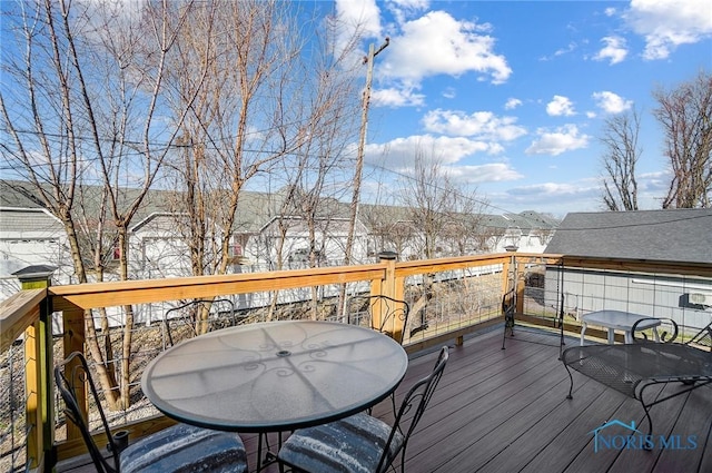 wooden deck featuring outdoor dining space