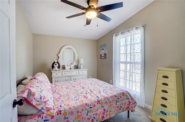 carpeted bedroom with baseboards, multiple windows, a ceiling fan, and lofted ceiling