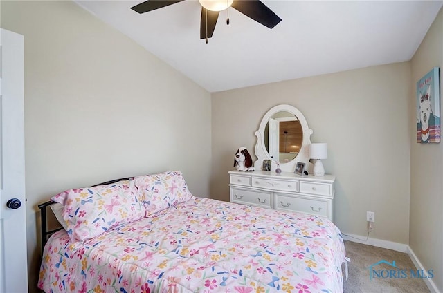 bedroom featuring baseboards, light carpet, and a ceiling fan