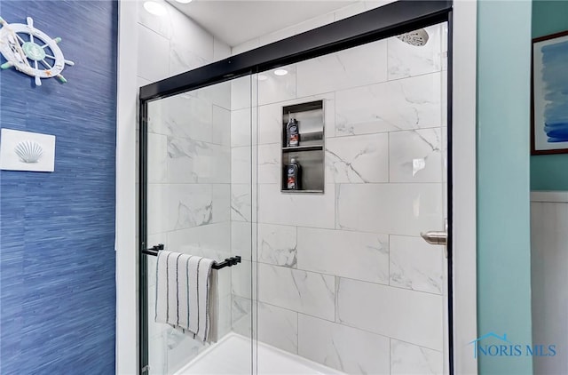 bathroom featuring a shower stall