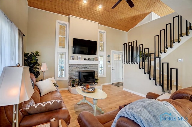 living room with wood finished floors, stairway, wood ceiling, and high vaulted ceiling