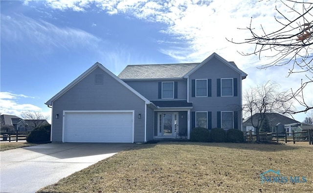 traditional-style house featuring a garage, a front yard, concrete driveway, and fence