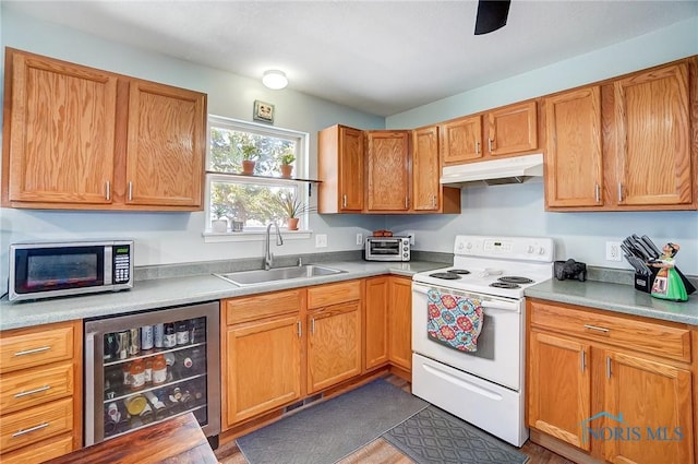 kitchen with electric stove, stainless steel microwave, a sink, beverage cooler, and under cabinet range hood