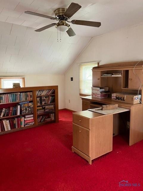 interior space with lofted ceiling, dark carpet, and a ceiling fan