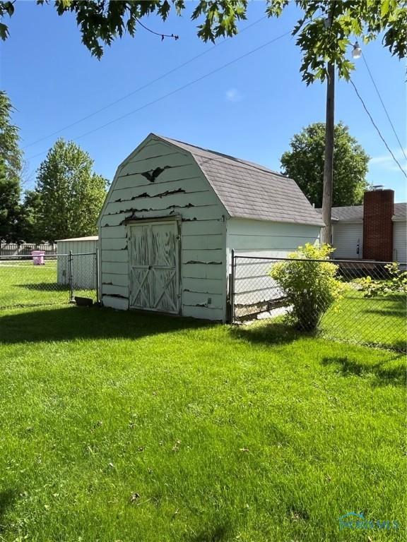 view of shed with fence