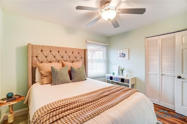 bedroom with a ceiling fan and a closet