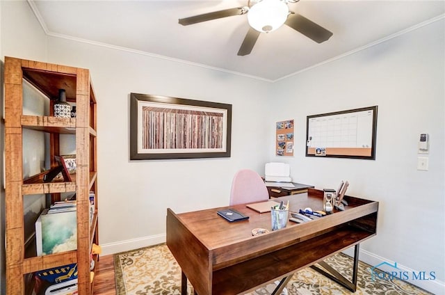 office area with ceiling fan, ornamental molding, baseboards, and wood finished floors