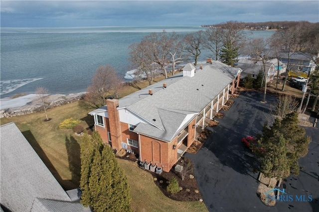 birds eye view of property featuring a water view