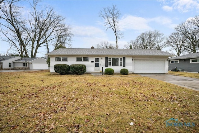 ranch-style house with an attached garage, concrete driveway, and a front yard