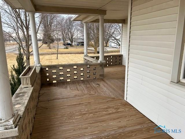 wooden terrace featuring a porch