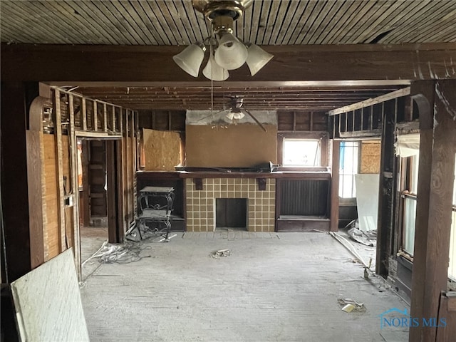 unfurnished living room with a ceiling fan