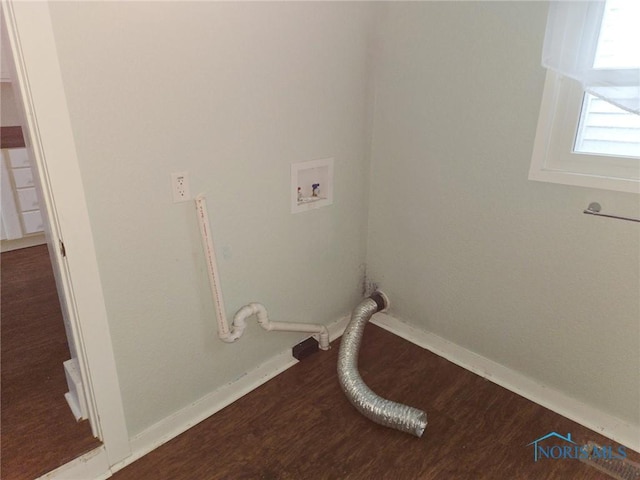 laundry area with hookup for a washing machine, laundry area, baseboards, and wood finished floors