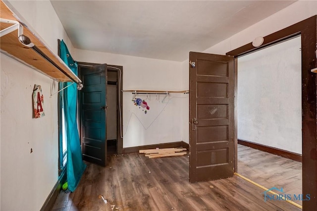 spacious closet with wood finished floors