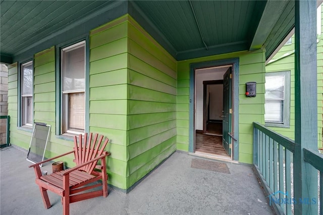 doorway to property with a porch