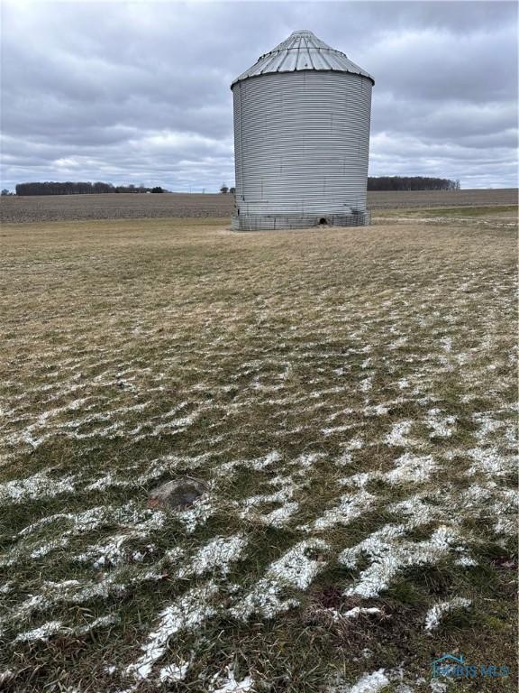 view of outdoor structure with an outbuilding and a rural view