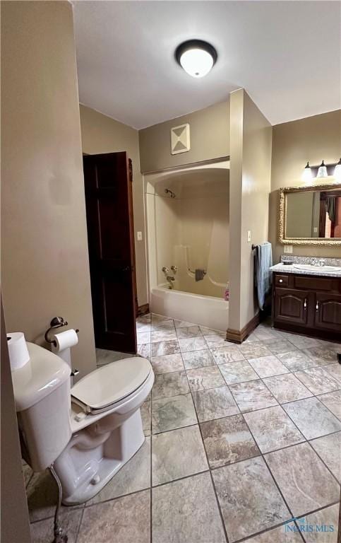 full bath with baseboards, tub / shower combination, vanity, and toilet