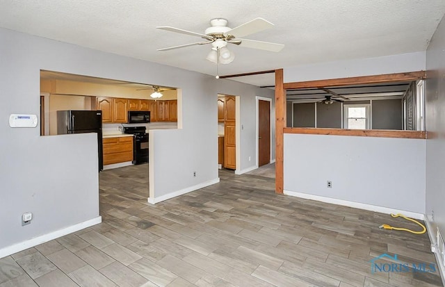 interior space with light wood-style floors, baseboards, and a ceiling fan