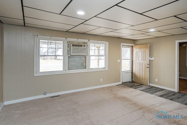 carpeted spare room with recessed lighting, baseboards, visible vents, and a wall mounted AC