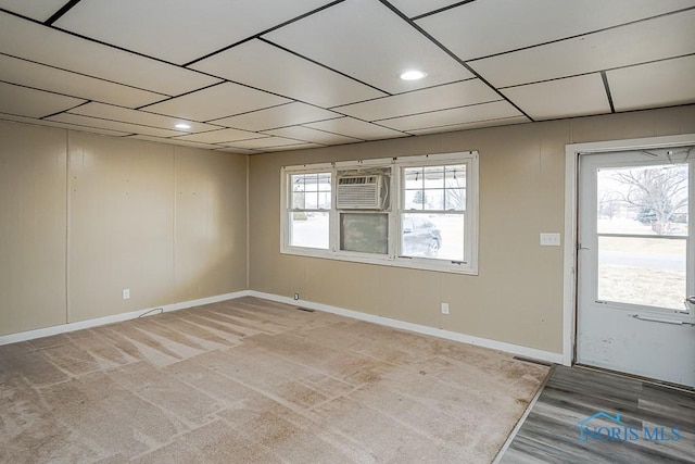 foyer featuring recessed lighting, an AC wall unit, and baseboards